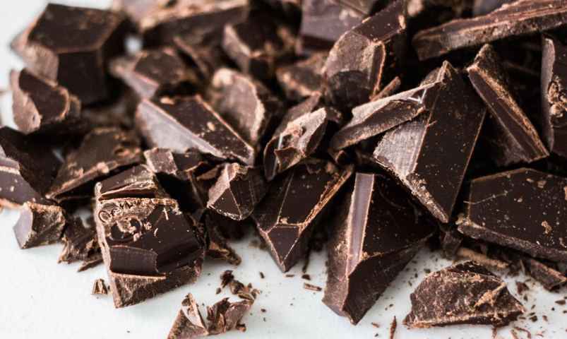 flakes of chocolate on a white background selective focus