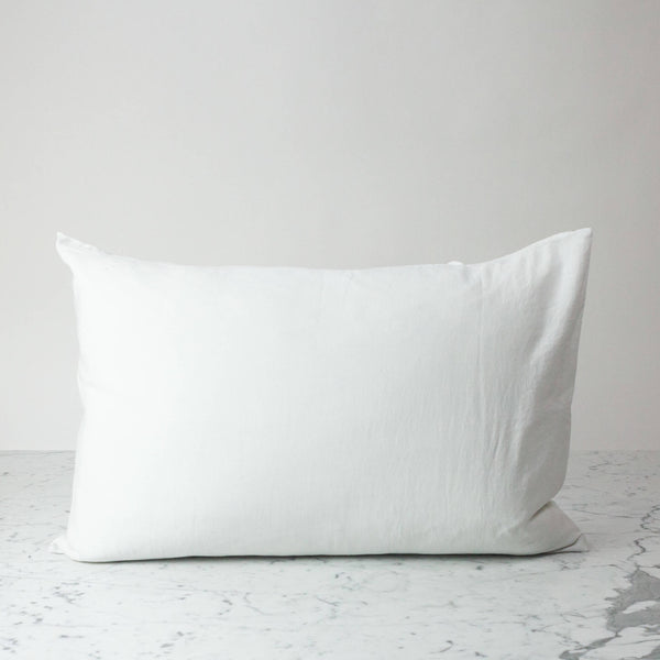 Copper pillowcase on a marble and white background